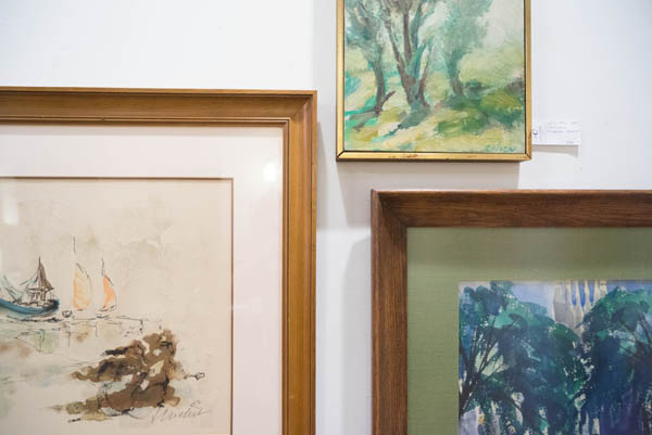 Vintage paintings at City Issue midcentury modern boutique in Atlanta; photo by Finely Crafted
